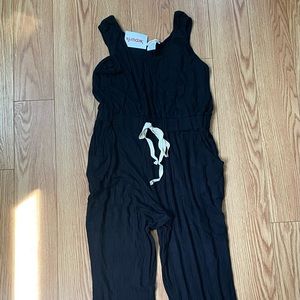 Black romper with tan drawstring. Size large. New with tags.
